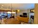 Open-concept living area with kitchen, dining space, and living room with fireplace; great for entertaining at 16 Via Visione # 102, Henderson, NV 89011