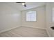 Empty bedroom with neutral walls, and a simple ceiling fan at 1830 N Buffalo Dr # 1091, Las Vegas, NV 89128