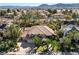 Aerial view of a large, luxurious home with a red tile roof and manicured landscaping at 1859 Woodhaven Dr, Henderson, NV 89074