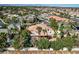 Aerial view of a home with a red tile roof in a lushly landscaped neighborhood at 1859 Woodhaven Dr, Henderson, NV 89074