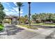 Well-manicured community entrance with brick-paved road and lush landscaping at 1859 Woodhaven Dr, Henderson, NV 89074