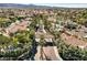 Elegant community entrance with mature trees and well-maintained landscaping at 1859 Woodhaven Dr, Henderson, NV 89074