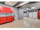 Spacious garage featuring ample storage cabinets and multiple garage doors for convenience at 1859 Woodhaven Dr, Henderson, NV 89074