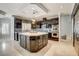 Spacious kitchen boasts a central island, stainless steel appliances, custom cabinetry, and sleek countertops for modern convenience at 1859 Woodhaven Dr, Henderson, NV 89074