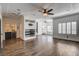 Open-concept living room with wet bar, hardwood floors, recessed lighting, and ceiling fan at 1859 Woodhaven Dr, Henderson, NV 89074