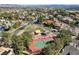 Aerial view of the community tennis court and surrounding neighborhood at 1859 Woodhaven Dr, Henderson, NV 89074