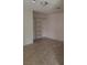 Bedroom featuring tile flooring and built-in shelves for convenient storage at 1936 St Lawrence Dr, Las Vegas, NV 89108