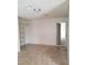 Bedroom with tile flooring, closet shelving, and a connecting doorway at 1936 St Lawrence Dr, Las Vegas, NV 89108