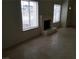 Inviting living room featuring tile floors, a fireplace, and large windows at 1936 St Lawrence Dr, Las Vegas, NV 89108