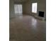 Bright living room with tile floors, fireplace, and sliding glass door at 1936 St Lawrence Dr, Las Vegas, NV 89108