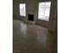 Spacious living room featuring tile floors, a cozy fireplace, and plenty of natural light at 1936 St Lawrence Dr, Las Vegas, NV 89108