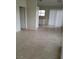 Open-concept space showcasing tile flooring, a sliding door, and a view into the kitchen area at 1936 St Lawrence Dr, Las Vegas, NV 89108