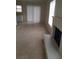 Bright living room with tile floors, fireplace, and sliding glass door at 1936 St Lawrence Dr, Las Vegas, NV 89108