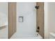Bright bathroom featuring tiled shower-tub with white subway tiles and modern black fixtures at 201 Kaelyn St # 4, Boulder City, NV 89005