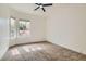 Bedroom with neutral carpet, windows, and a blank canvas at 201 Kaelyn St # 4, Boulder City, NV 89005