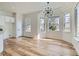 Bright dining area featuring wood floors, recessed lighting, and a modern chandelier at 201 Kaelyn St # 4, Boulder City, NV 89005