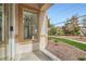 Inviting covered front porch with desert landscaping and view of the mountains in the background at 201 Kaelyn St # 4, Boulder City, NV 89005