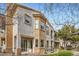 Charming townhome exterior with private balcony and stucco facade at 201 Kaelyn St # 4, Boulder City, NV 89005