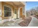 Inviting front entrance of a home with a brick accent wall, a window, and landscaped pathway at 201 Kaelyn St # 4, Boulder City, NV 89005