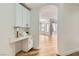 Open concept with hardwood floors and an arched hallway leading to the light-filled living area at 201 Kaelyn St # 4, Boulder City, NV 89005