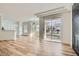 Open-concept living room featuring modern lighting, fireplace, and a seamless connection to the kitchen at 201 Kaelyn St # 4, Boulder City, NV 89005