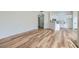 Spacious living area with wood-style flooring that transitions to the kitchen at 201 Kaelyn St # 4, Boulder City, NV 89005