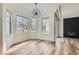 Bright living room with modern lighting, wood-look flooring and updated trim at 201 Kaelyn St # 4, Boulder City, NV 89005