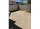 Spacious concrete patio area in a private backyard with a block wall and minimal landscaping at 206 Valerian St, Henderson, NV 89015