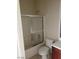 Bathroom featuring a shower-tub, tiled floor and white walls at 206 Valerian St, Henderson, NV 89015