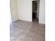 A view from a bedroom into the bathroom with a neutral color vanity at 206 Valerian St, Henderson, NV 89015