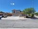 A two-story home boasting a three-car garage and a well-maintained front yard at 206 Valerian St, Henderson, NV 89015