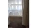 Hallway featuring railing with view into the living area at 206 Valerian St, Henderson, NV 89015