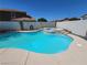 Sparkling backyard pool with a built-in spa and clear blue water, surrounded by block fencing at 206 Valerian St, Henderson, NV 89015