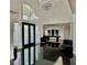 Grand foyer featuring glossy black tile floors, high ceilings, and a modern light fixture at 2221 S Tioga Way, Las Vegas, NV 89117