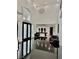 Bright foyer with high ceilings, modern lighting, and a glimpse of the game room at 2221 S Tioga Way, Las Vegas, NV 89117