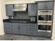 Galley-style kitchen featuring stainless steel appliances and a cooktop at 2221 S Tioga Way, Las Vegas, NV 89117