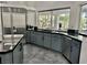 Beautiful kitchen featuring stainless steel appliances, granite countertops, and a modern sink at 2221 S Tioga Way, Las Vegas, NV 89117