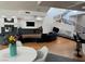 Expansive living room featuring modern finishes, a fireplace, bar and a spiral staircase at 2221 S Tioga Way, Las Vegas, NV 89117