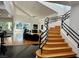 Bright open-plan living room with a staircase and large windows, great for natural light at 2221 S Tioga Way, Las Vegas, NV 89117