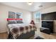 Well lit bedroom featuring a modern bed and neutral walls at 2305 Dalton Ridge Ct, North Las Vegas, NV 89031