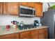 Kitchen with stainless steel microwave, gas cooktop and granite countertops at 2305 Dalton Ridge Ct, North Las Vegas, NV 89031