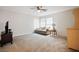 Spacious living room with ample natural light and neutral carpeting at 2305 Dalton Ridge Ct, North Las Vegas, NV 89031