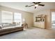 Living room featuring neutral walls, carpet, and a cream sofa at 2305 Dalton Ridge Ct, North Las Vegas, NV 89031