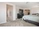 Bright main bedroom with an ensuite bathroom and lots of space for a dresser and a TV at 2305 Dalton Ridge Ct, North Las Vegas, NV 89031