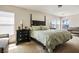 Main bedroom with carpet flooring, natural lighting, and dark furniture at 2305 Dalton Ridge Ct, North Las Vegas, NV 89031