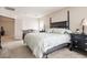 Spacious main bedroom featuring a four-poster bed, neutral decor, and lots of natural light at 2305 Dalton Ridge Ct, North Las Vegas, NV 89031