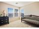 Sitting area features three windows for natural light and a comfortable place to relax or read at 2305 Dalton Ridge Ct, North Las Vegas, NV 89031