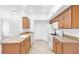 Well-lit kitchen featuring granite countertops, ample cabinetry, and white appliances at 2615 W Gary Ave # 1041, Las Vegas, NV 89123