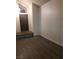 Welcoming entryway featuring wood-look floors, a well-lit foyer, and a neutral color palette at 2720 Knightsbridge Rd, Henderson, NV 89074