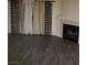 Open living room with fireplace and vinyl wood flooring at 2720 Knightsbridge Rd, Henderson, NV 89074